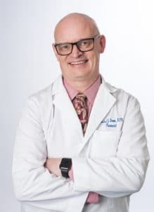 Michael Brown in Lab Coat with arms crossed