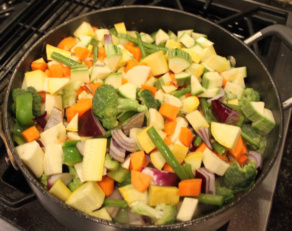 All vegetables added to the chicken, curry mixture and tomatoes