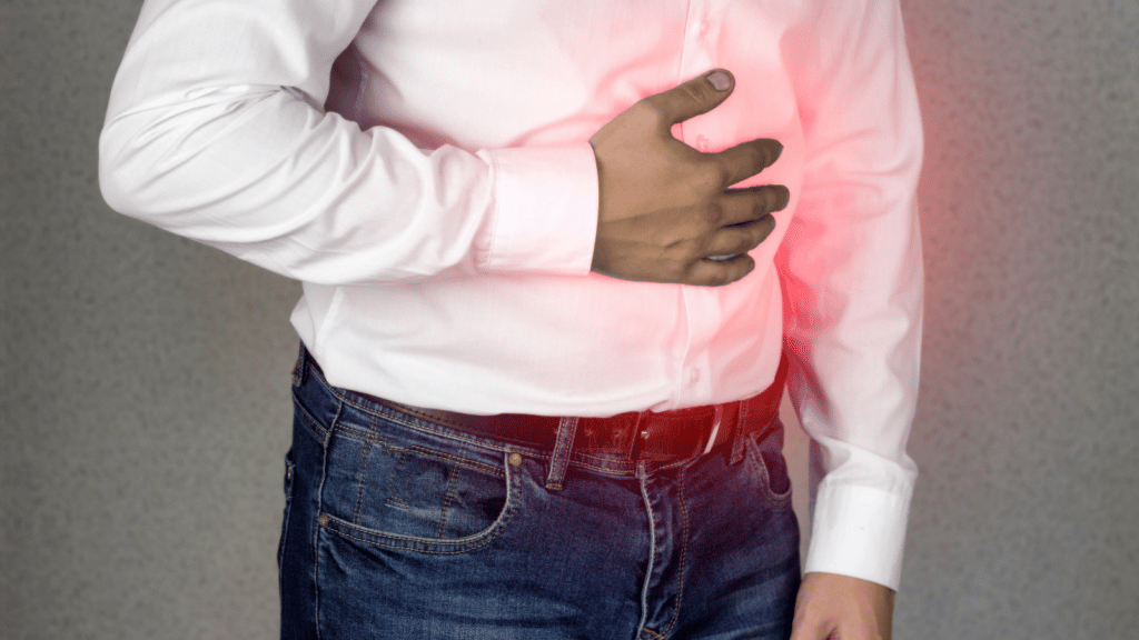 man holding stomach in pain