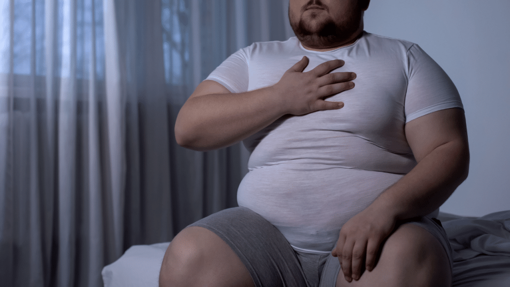 obese man with heartburn